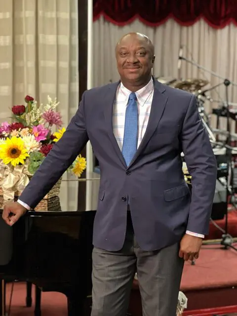 Man in suit with colorful flower bouquet