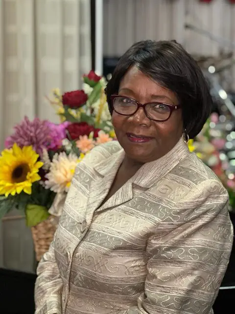 Lady posing with colorful flowers