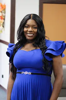 Smiling woman with long hair indoors